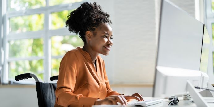 A photo of someone on a computer.