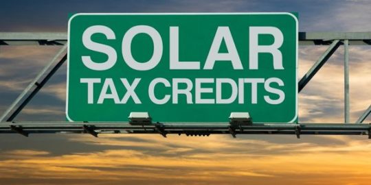 sign that says solar tax credits