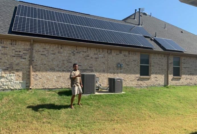 A photo of one of clean energy cu members and their solar panels.
