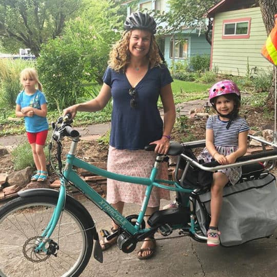 woman on electric bike with children