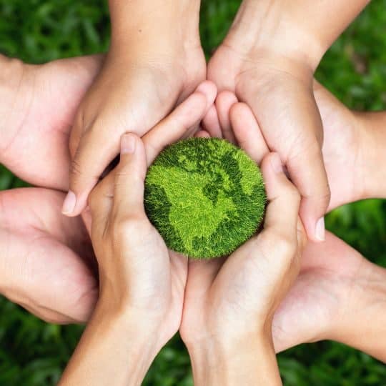 Hands supporting the earth