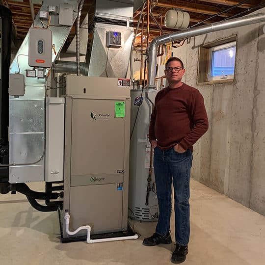 man in front of heater