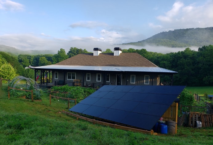 remote home with solar panels in front